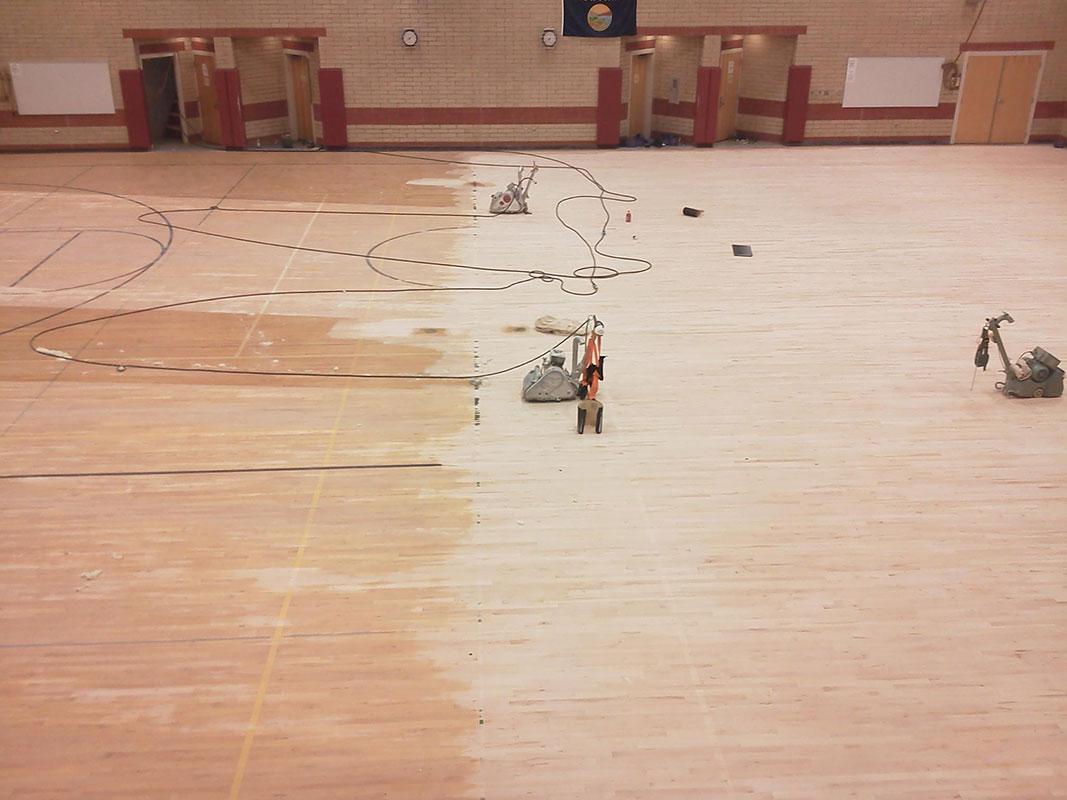 preparing a gym floor for refinihsing